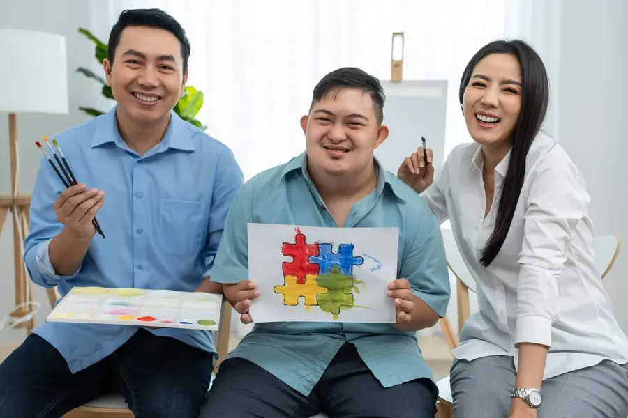 A support coordinator meeting warmly with a participant and a family member